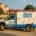 A Service Truck Is Parked In Front Of A Suburban House, Showcasing A Local Business Ready To Assist Customers In The Area. This Image Reflects The Importance Of Managing Multiple Business Locations And Enhancing Online Reputation Through Local Seo Strategies.