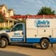 A Service Truck Is Parked In Front Of A Suburban House, Showcasing A Local Business Ready To Assist Customers In The Area. This Image Reflects The Importance Of Managing Multiple Business Locations And Enhancing Online Reputation Through Local Seo Strategies.